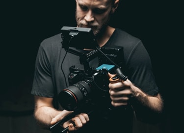 A man holding a fancy camera rig