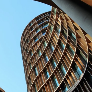 Looking up at a winding skyscraper